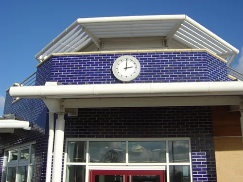 A building with a clock on the front of it.